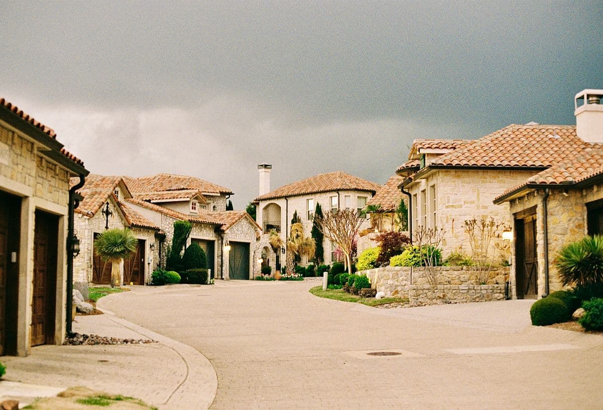 View of Arlington, Texas showing the downtown skyline and typical suburban homes in the Dallas-Fort Worth metroplex that face water damage risks from summer storms and aging infrastructure