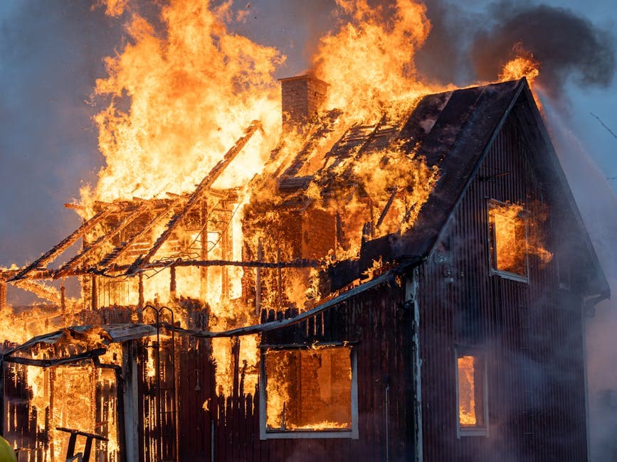 Fire-damaged residential property in Carrollton, TX showing smoke and structural damage after a house fire