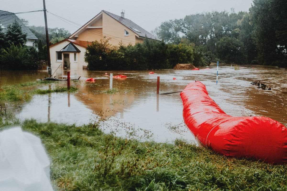 Flooded residential area protected by flood barriers during heavy rain in Fort Worth, Texas