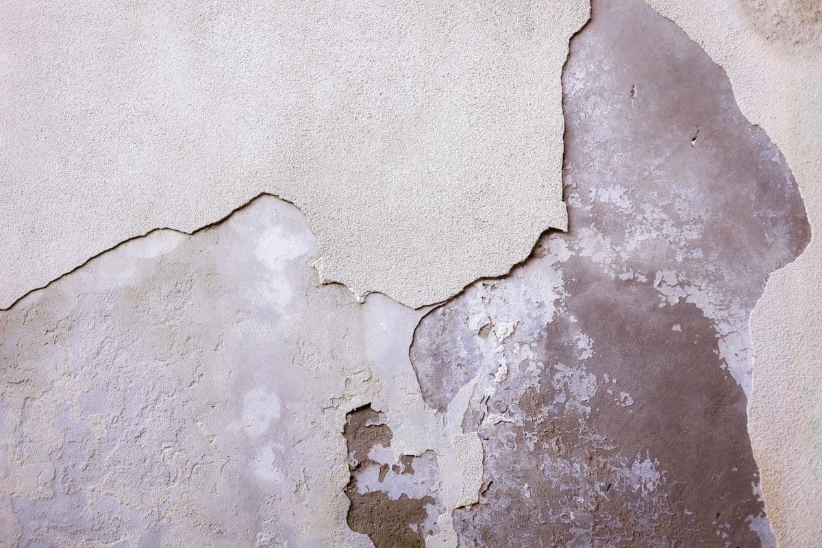 Water damage on an interior wall from a leaking pipe in a Lewisville, Texas home, showing the kind of moisture intrusion that requires professional drying and restoration