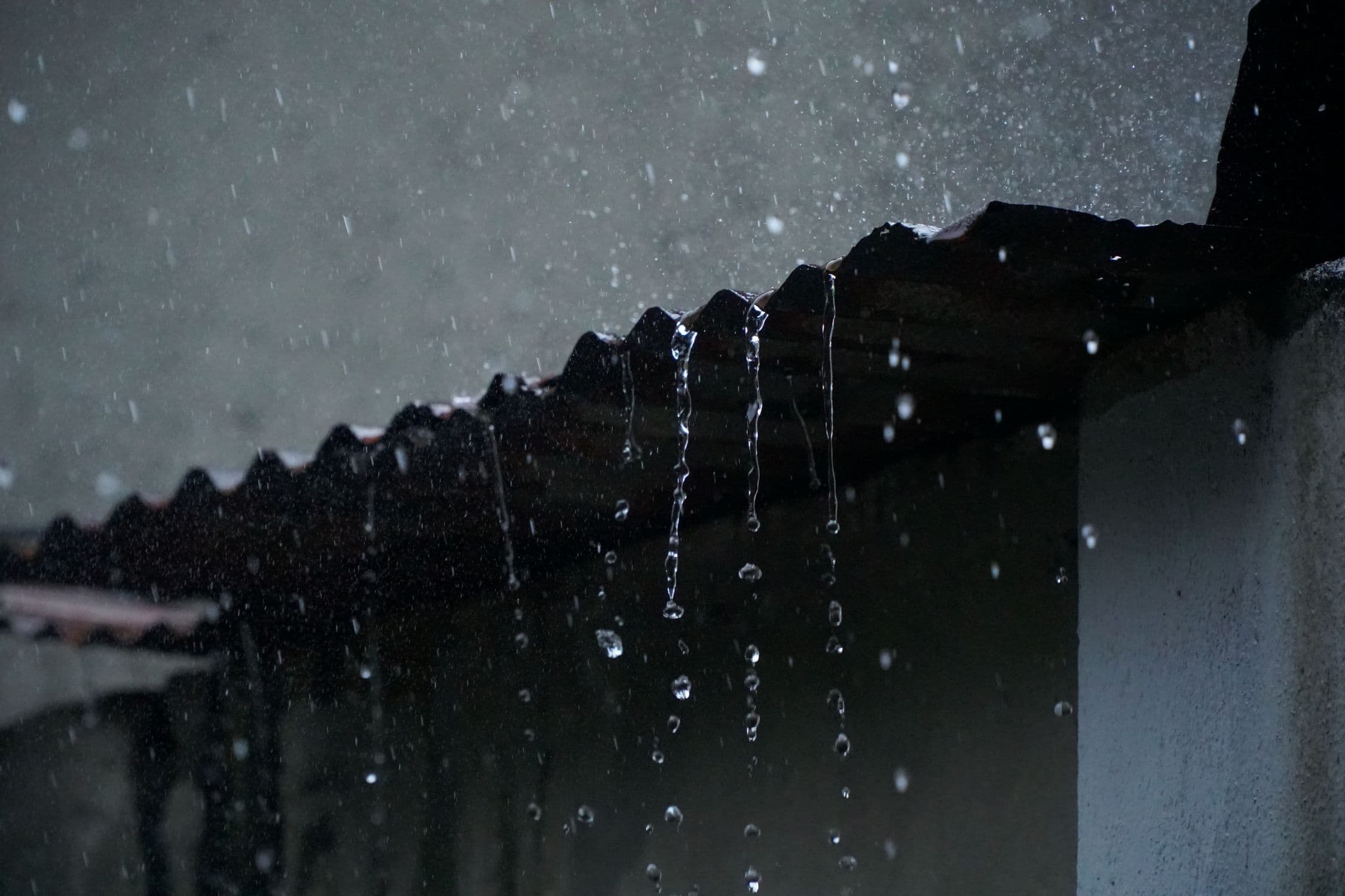 Summer storm flash flooding in a McKinney, Texas neighborhood showing standing water after a thunderstorm, illustrating the type of emergency flood damage McKinney homeowners face during summer storm season