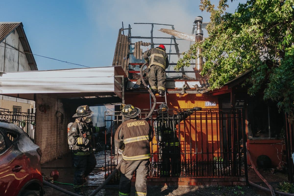 Firefighters putting out a house fire in a Plano neighborhood after a structure fire