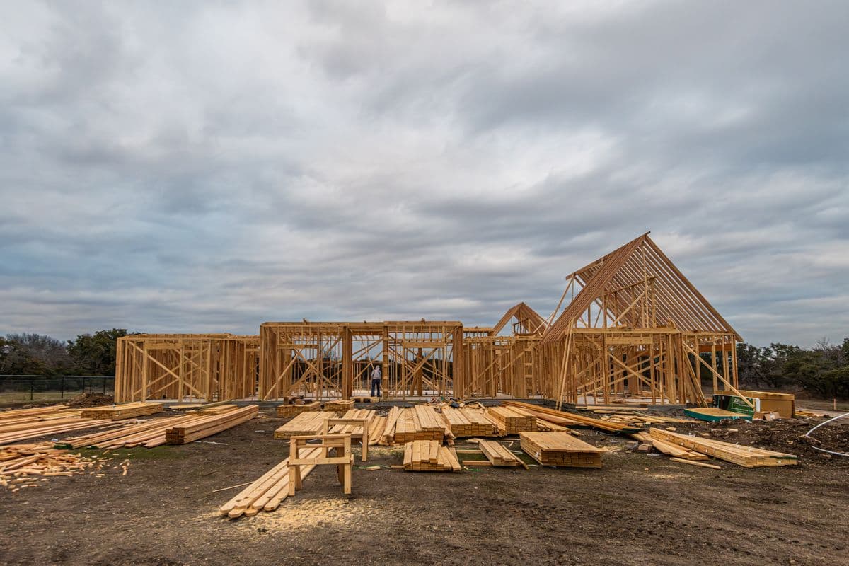 Exposed wooden framing during a home construction project in Fort Worth, TX, showing what Garland homeowners can expect during the reconstruction phase of mold remediation