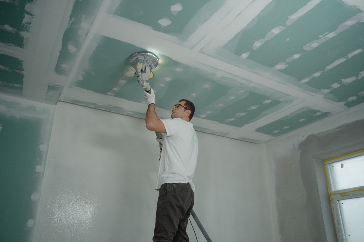 Water damage stain on a residential ceiling in a DFW home showing the visible discoloration and texture damage that requires professional ceiling water damage repair